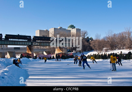 Outdoor ice hockey on the Assiniboine River, The Forks, Winnipeg, Manitoba, Canada Stock Photo