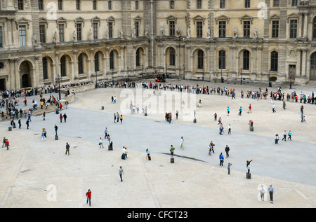 Looking down on visitors queuing in the courtyard of the Louvre Museum in Paris, France. Stock Photo