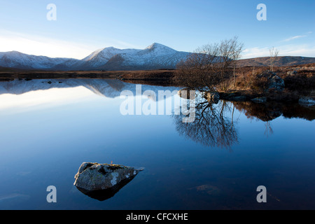 Black Mount Hills and their reflection in the flat calm Lochain na h'Achlaise, Rannoch Moor, Highland, Scotland, UK Stock Photo