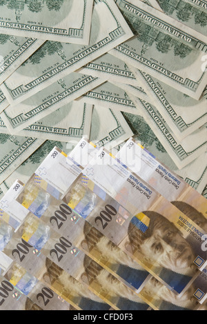 Image pile of banknotes - u.s. dollars and Swiss francs Stock Photo