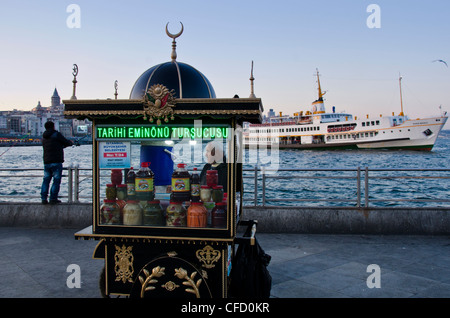 Food kiosk on the Golden Horn by the Galata Bridge, located in the Eminönü district of Istanbul, Turkey. Stock Photo