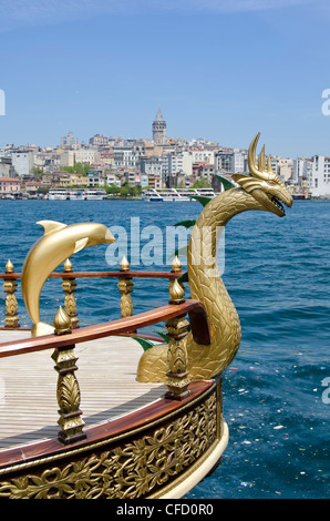 Floating restaurants on the Golden Horn by the Galata Bridge, located in the Eminönü district of Istanbul, Turkey. Stock Photo