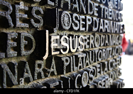 Close up of writing which fills the bronze doors of the Sagrada Familia, UNESCO World Heritage Site, Barcelona, Catalonia, Spain Stock Photo