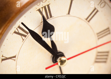 Alarm clock. It's five minutes to twelve p.m. Close up shot. Stock Photo