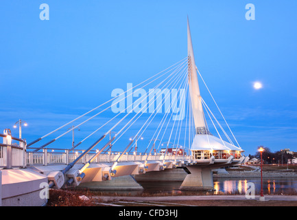 Esplanade Riel Pedestrian Bridge spanning the Red River, on a moonlit night. Winnipeg, Manitoba, Canada. Stock Photo