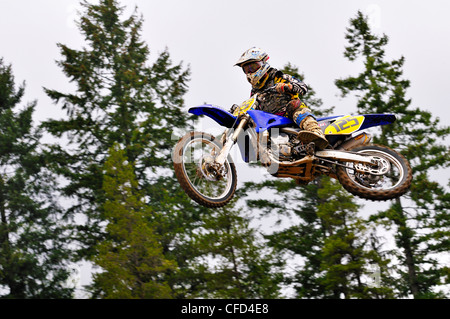 Motocross rider #125 gets airborne during a jump at the Wastelands track in Nanaimo, British Columbia, Canada. Stock Photo