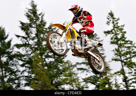 Motocross rider #157 gets airborne during a jump at the Wastelands track in Nanaimo, British Columbia, Canada. Stock Photo