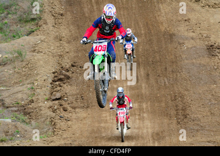 Motocross rider #409 gets airborne during jump Stock Photo