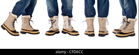 man legs in blue jeans and heavy snow boots, four poses isolated on white Stock Photo
