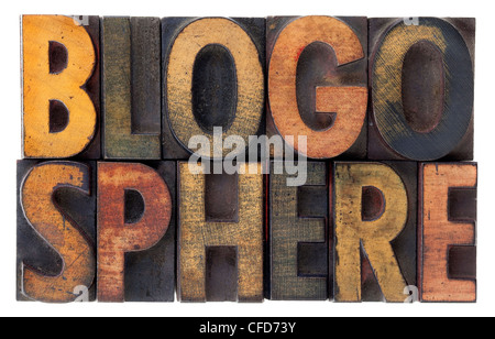 word blogosphere (global blog community) in vintage wood letterpress types, stained by ink, isolated on white Stock Photo