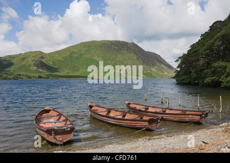 Fishermen's boats on Crummock Water, Lingmell Fell in background, Lake District National Park, Cumbria, England, United Kingdom Stock Photo