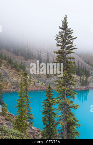 Moraine Lake in fog, Banff National Park, Alberta, Canada. Stock Photo