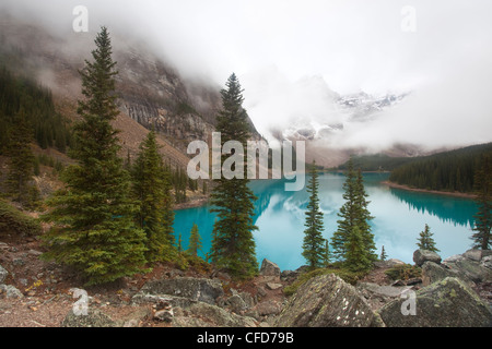 Moraine Lake in fog, Banff National Park, Alberta, Canada. Stock Photo