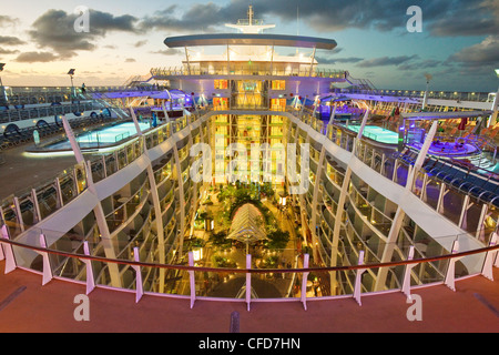 High angle nightime view of Central Park, one of seven 'neighborhoods' on board Royal Caribbean's Oasis of the Seas cruise ship. Stock Photo