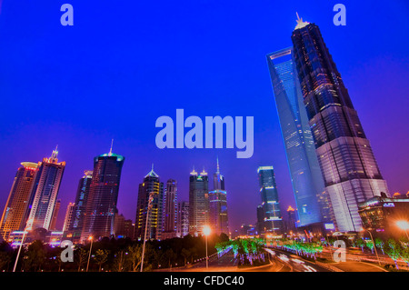 Lujiazui skyline by night with the Jinmao tower and the Shanghai World Financial Center on the right - Shanghai (China) Stock Photo