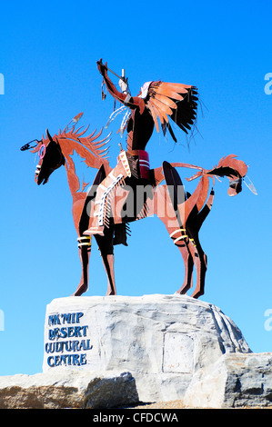 A statue of a native Indian with head dress, on a horse at Nk'Mip Desert Cultural Centre, Osoyoos, British Columbia, Canada Stock Photo