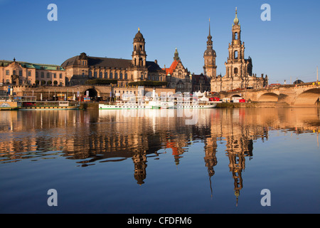 View over the Elbe river to Bruehlsche Terrasse, Staendehaus, Dresden castle and church Hofkirche in the evening light, Dresden, Stock Photo
