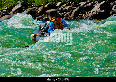 Man in raft, fly fishing, Dean River, British Columbia, Canada Stock Photo