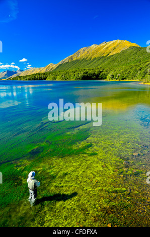 Man fly fishing, Mavora Lake, South Island, New Zealand Stock Photo
