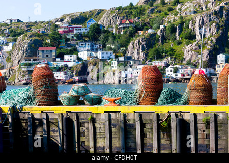 Crab traps on southside of St. John's Harbour with the Battery in background, Newfoundland, Canada Stock Photo