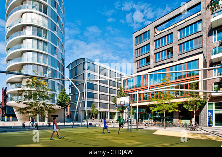 Children playing volleyball, HafenCity, Hamburg, Germany Stock Photo