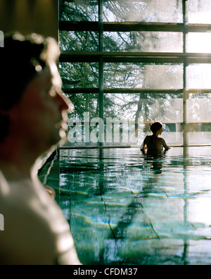 Couple bathing in indoor pool, Vigilius Mountain Resort, Vigiljoch, Lana, Trentino-Alto Adige/Suedtirol, Italy Stock Photo