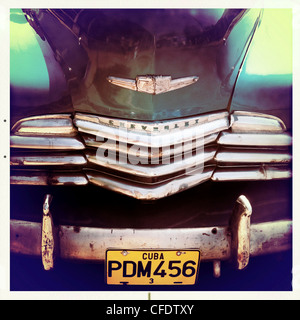 Detail of the front of an old green Chevrelet showing the chrome grill and numberplate, Vinales, Cuba, West Indies Stock Photo