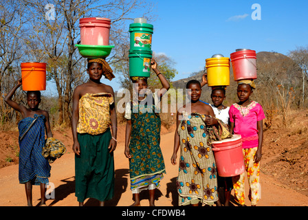 Group of women carrying water on head, Tanzania, East Africa, Africa Stock Photo
