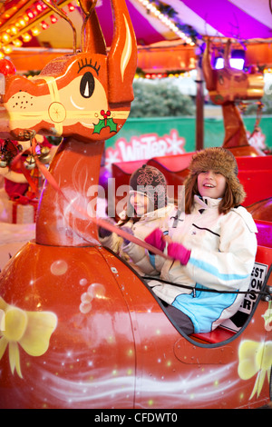 Children enjoying the rides at,Wonderland, Hyde Park, London, England, United Kingdom, Europe (Panning) Stock Photo