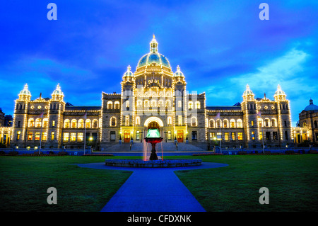 The Parliament Buildings and fountain in front of them at dusk in Victoria, British Columbia, Canada Stock Photo