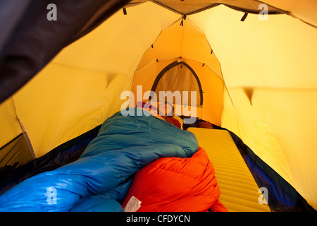 A man sleeping in tent, Jasper Provincial Park, Alberta, Canada Stock Photo