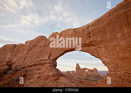 Turret Arch through North Window at dawn, Arches National Park, Utah, United States of America, Stock Photo
