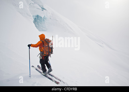 A man ski touring on a glacier while on a backcountry ski hut trip in the canadian rockies near Golden, British Columbia, Canada Stock Photo