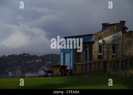 An exterior view of the Seafood Temple restaurant in Oban with the town in the background Stock Photo