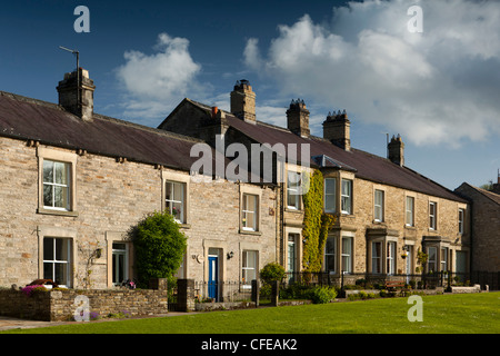 UK, England, Yorkshire, Wensleydale, West Burton village, solid stone properties around the green Stock Photo