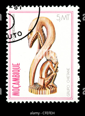 Postage stamp from Mozambique depicting a sculpture of a chietane. Stock Photo