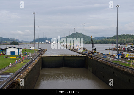 Gates and basin of Miraflores Locks Panama Canal filling with water Stock Photo