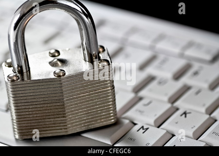 locked padlock on computer keyboard Stock Photo
