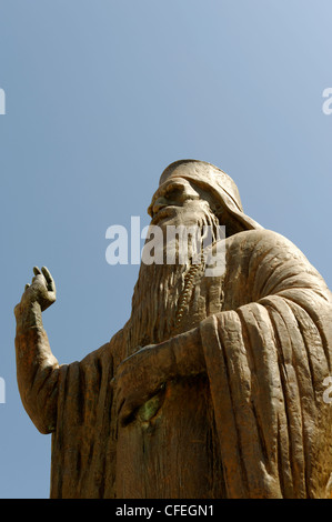 Statue of a Greek Orthodox priest in front of the Orthodox Cathedral in the beautiful Venetian harbour town of Chania Stock Photo