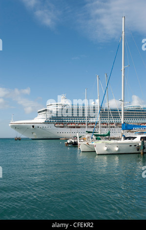The Emerald Princess cruise ship at the terminal with The Renaissance Marina in foreground, Oranjestad, Aruba, The Caribbean Stock Photo