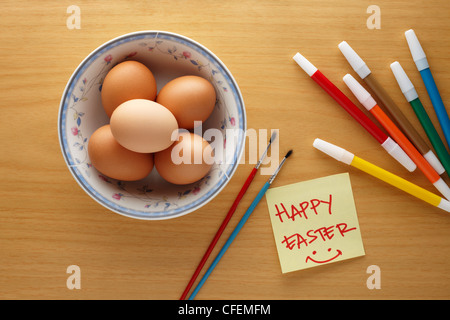 preparation to decorate easter eggs with markers and brushes Stock Photo