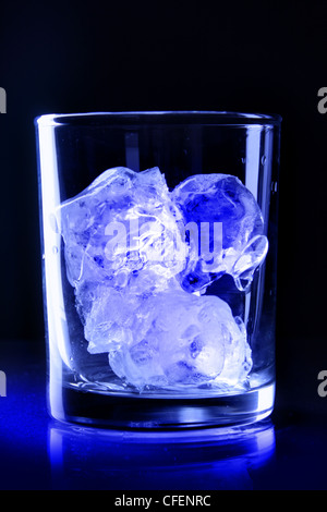 Close up on big ice cubes into glass of water Stock Photo - Alamy