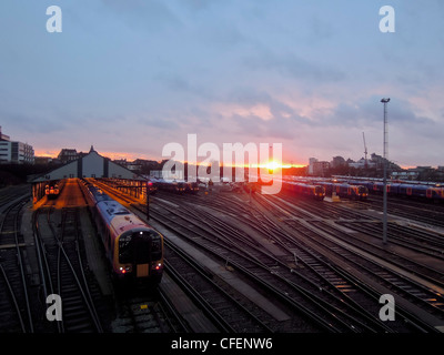 The winter sun sets over the railway sidings at Clapham Junction Station, Wandsworth, London, UK. Stock Photo