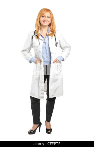 Full length portrait of a female doctor posing isolated on white background Stock Photo