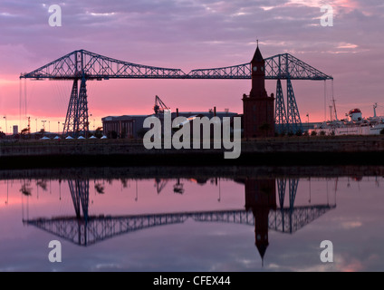 Middlesbrough bridge at night on the river Tees with a pink sky and lovely reflections Stock Photo