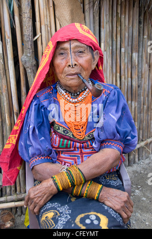 Kuna woman smoking a pipe, Playon Chico Village, San Blas Islands (Kuna Yala Islands), Panama, Central America Stock Photo