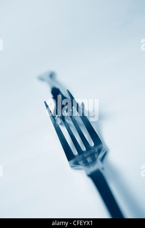 Steel forks in modern blue Stock Photo