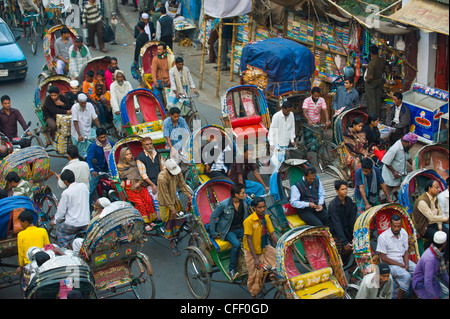 Busy rickshaw traffic on a street crossing in Dhaka, Bangladesh, Asia Stock Photo