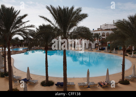 A palm fringed swimming pool within the Royal Savoy Resort at Sharm el-Sheikh, Egypt, North Africa, Africa Stock Photo