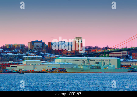 Ship tied up at Naval dockyards at dawn in winter, Halifax, Nova Scotia, Canada Stock Photo